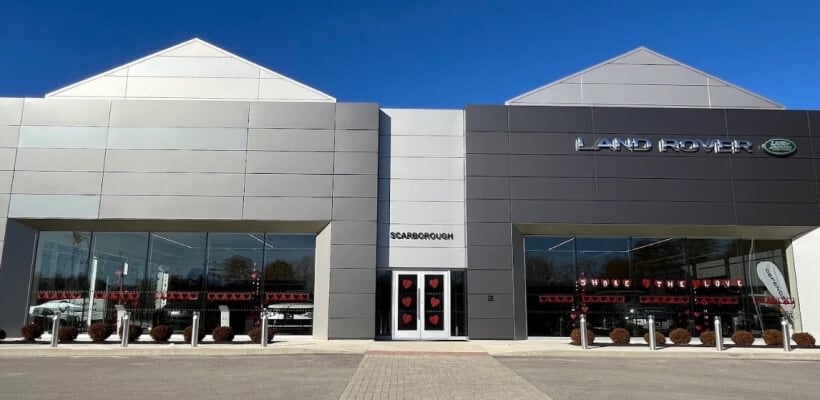 Front exterior view of the Land Rover Scarborough dealership building with a glass storefront.
