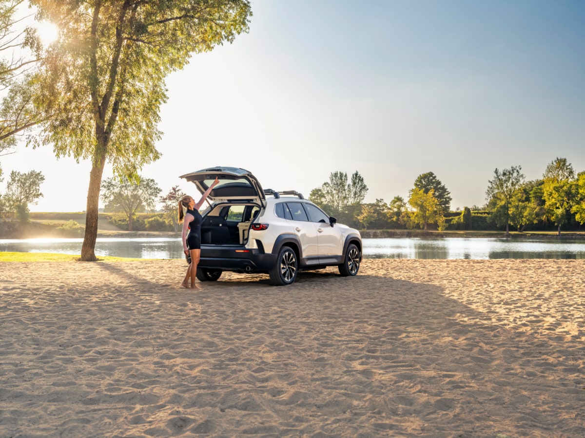A 2026 Mazda CX-50 parked by a pond