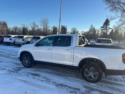 Featured used cars, trucks, and SUVs 2023 Honda Ridgeline RTL-E Truck Crew Cab for sale near you in Grand Forks, ND