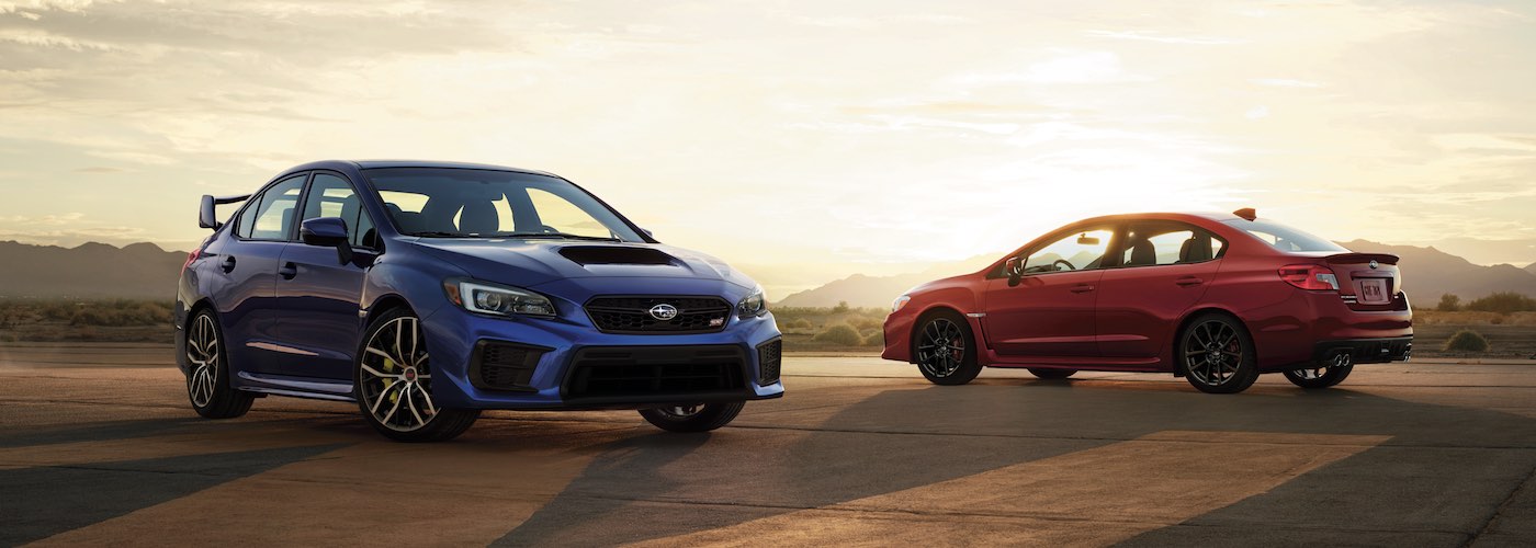 2020 Subaru WRX and Impreza parked in a desert