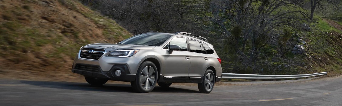 2018 Subaru Outback driving on a rural road