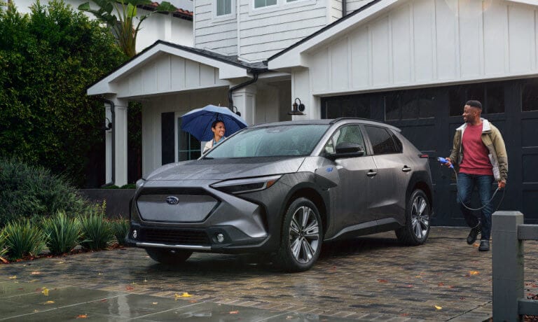 2024 Subaru Solterra Exterior Charging In Driveway