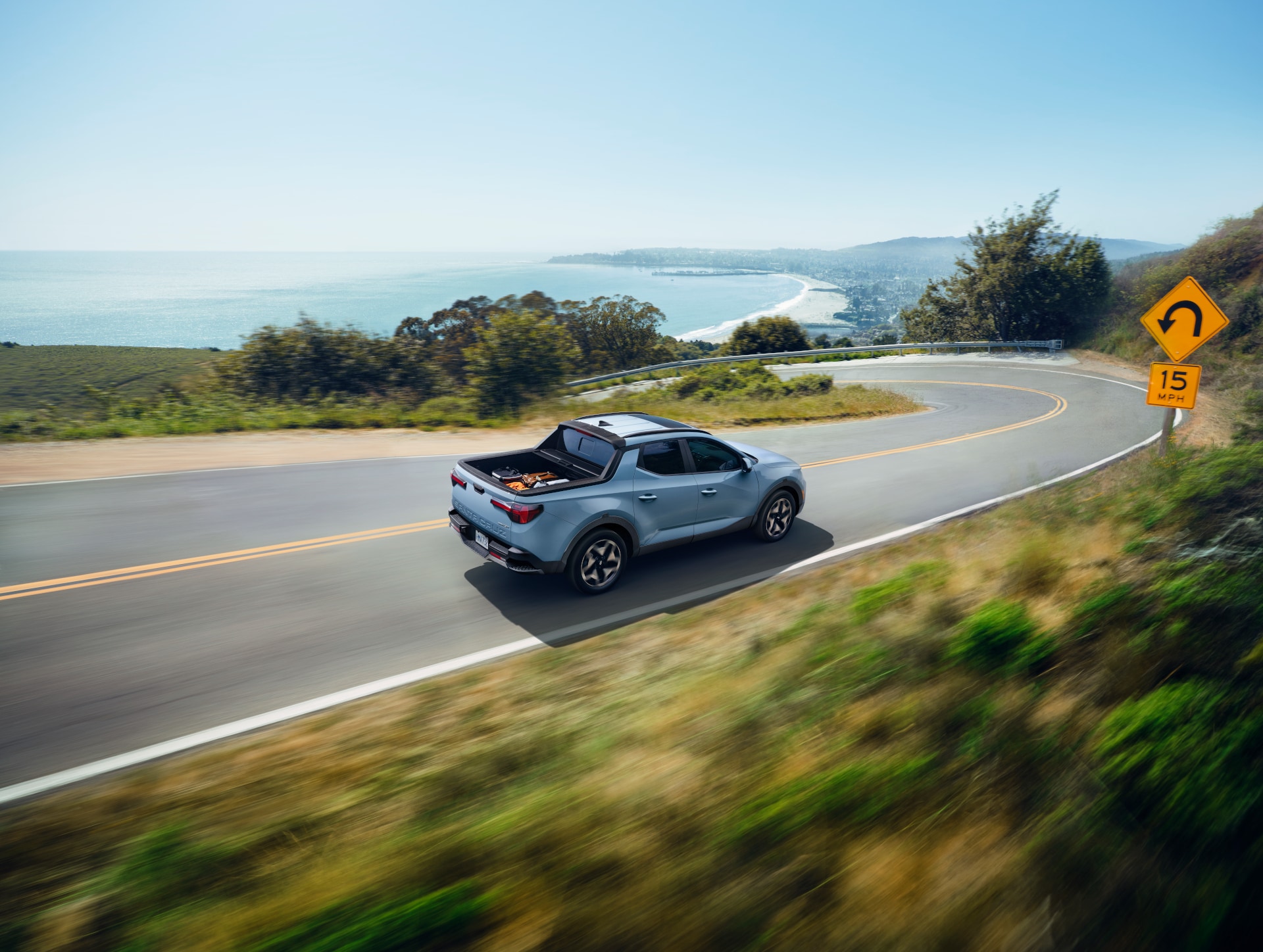 The Hyundai Santa Cruz shown driving on a scenic highway