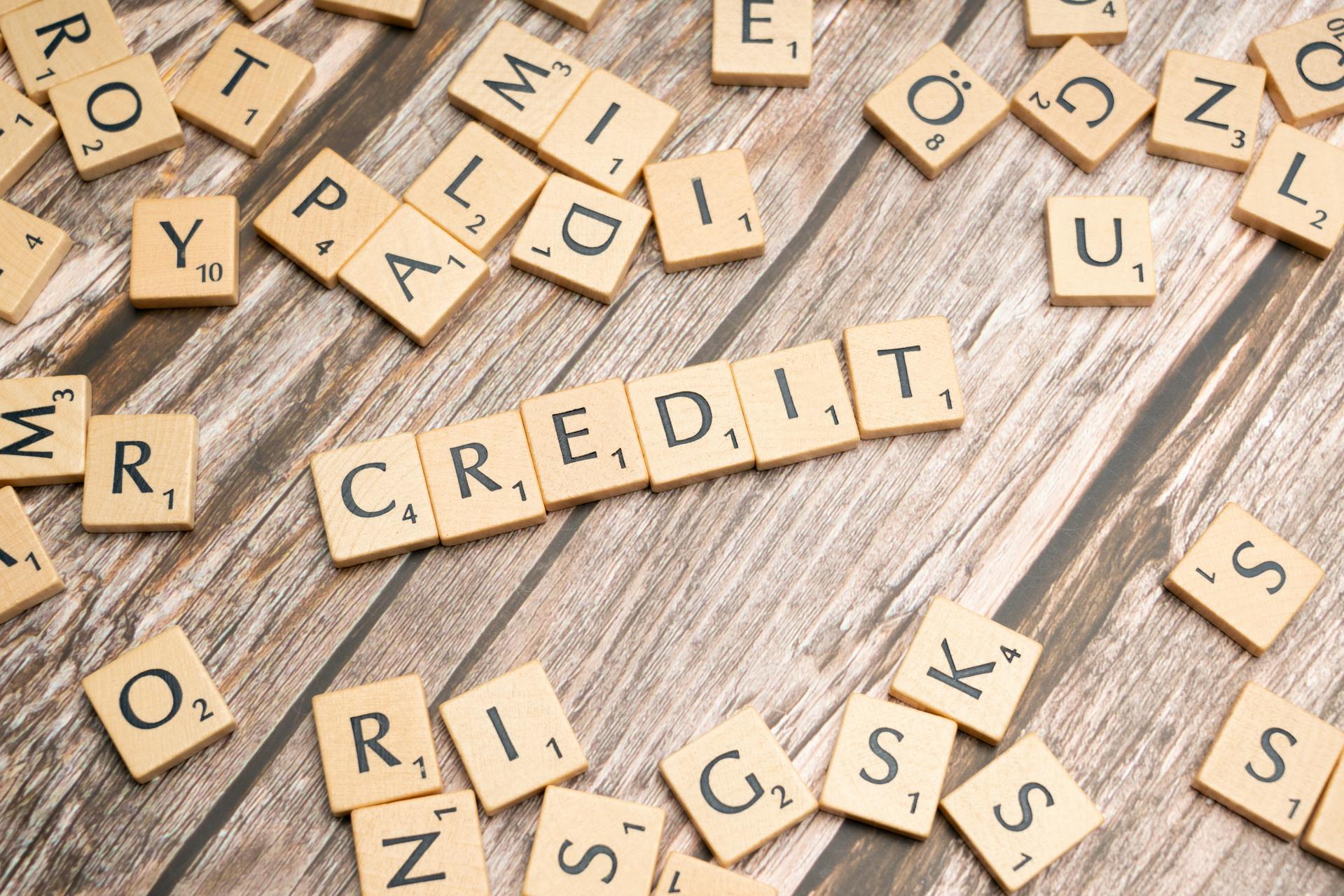 The word credit spelt out using Scrabble tiles
