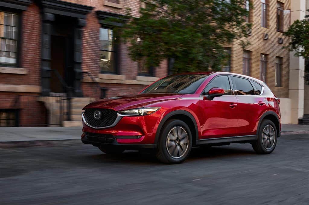 2024 Mazda CX-5 driving through the city