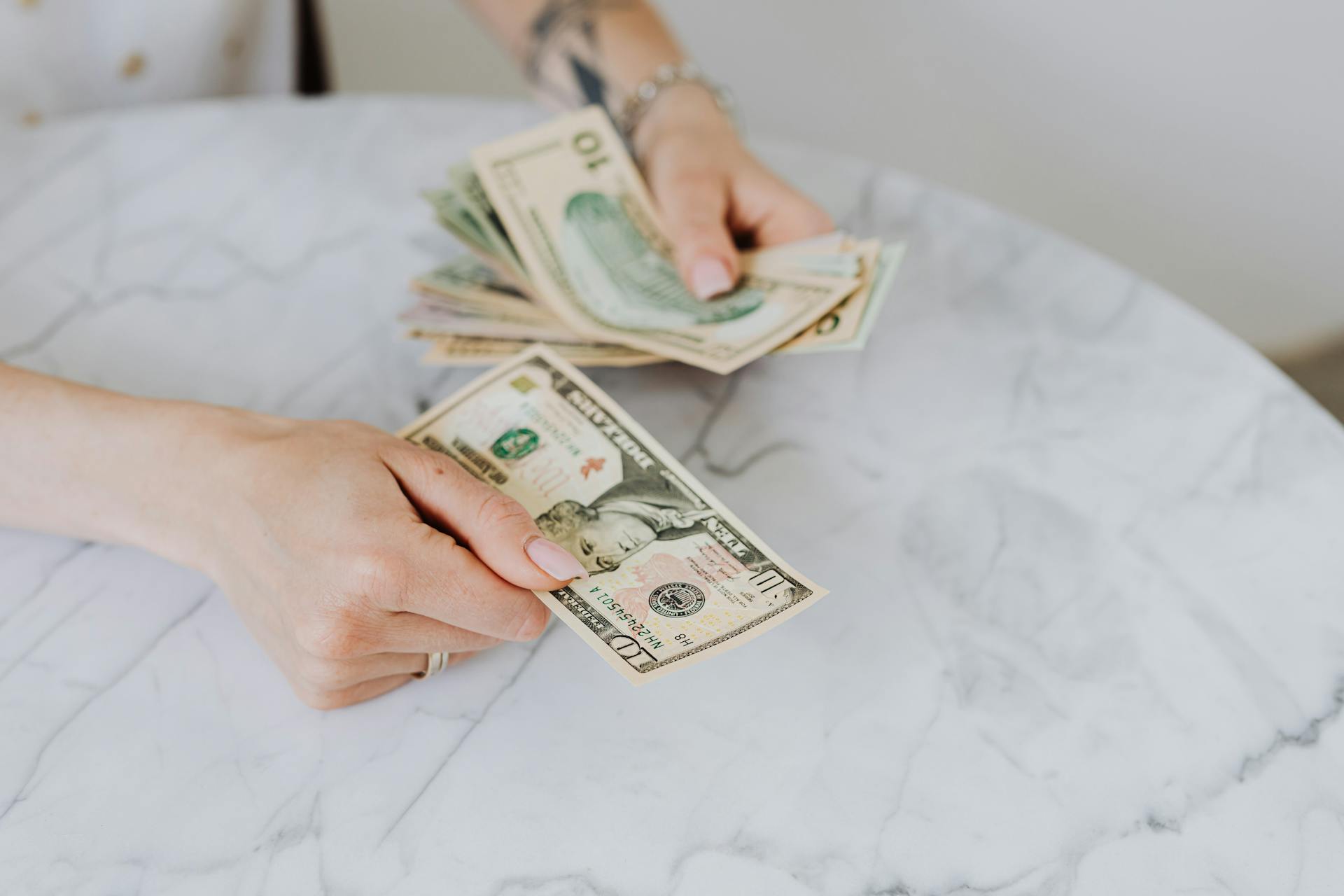 A person holding cash