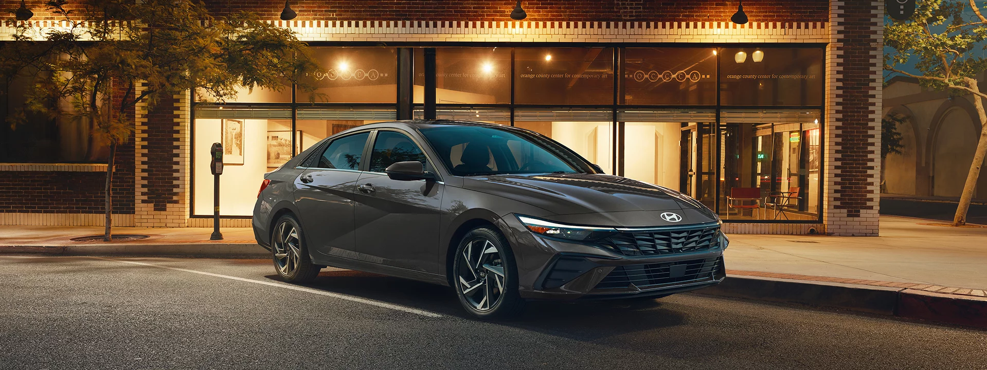 2024 Hyundai Elantra Hybrid parked in front of a store