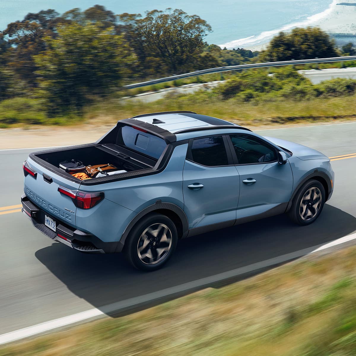 2024 Hyundai Santa Cruz driving down the road