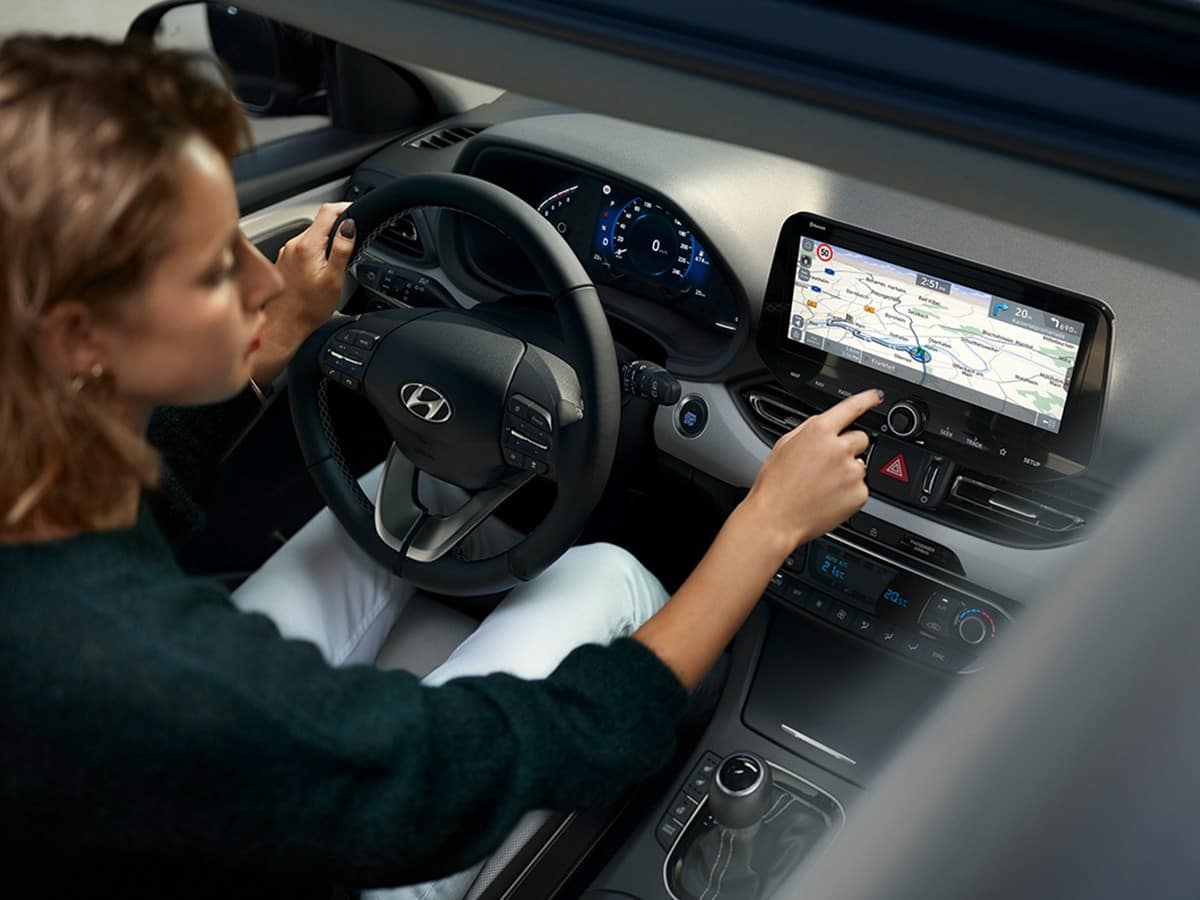 Picture of women using the Hyundai Dynamic Voice Recognition system