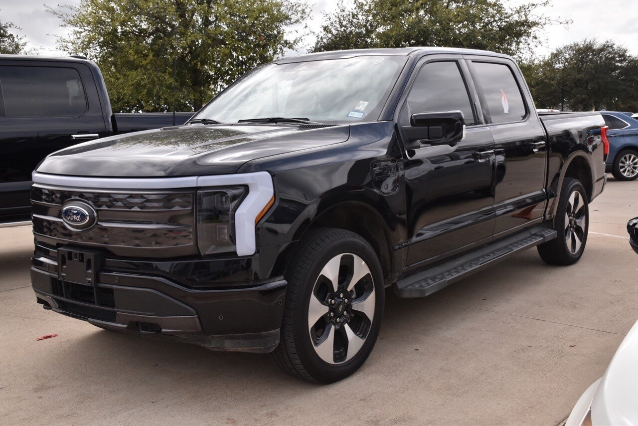 Used 2023 Ford F-150 Lightning Platinum with VIN 1FT6W1EV0PWG28733 for sale in Grapevine, TX