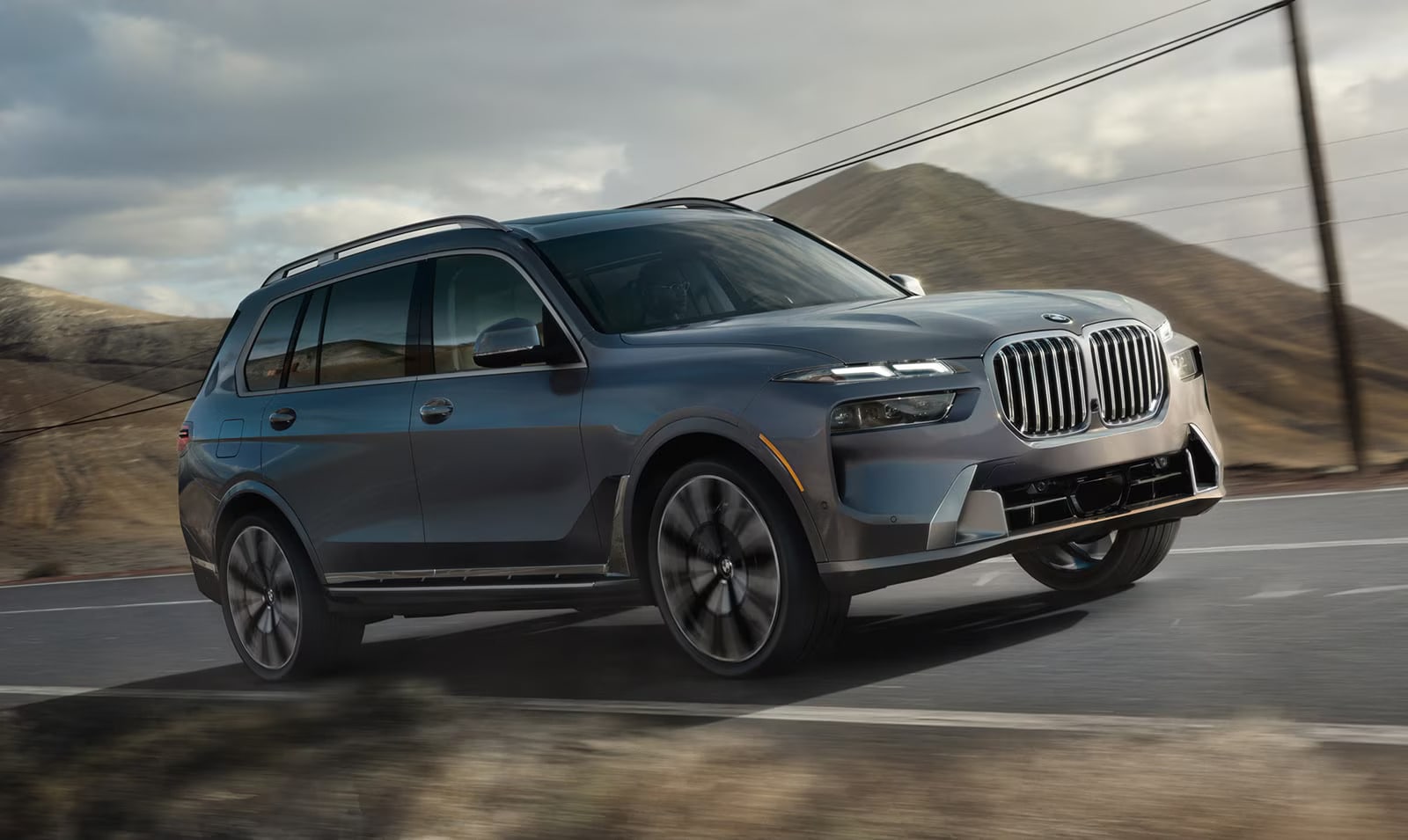 2027 bmw x7 driving on a road