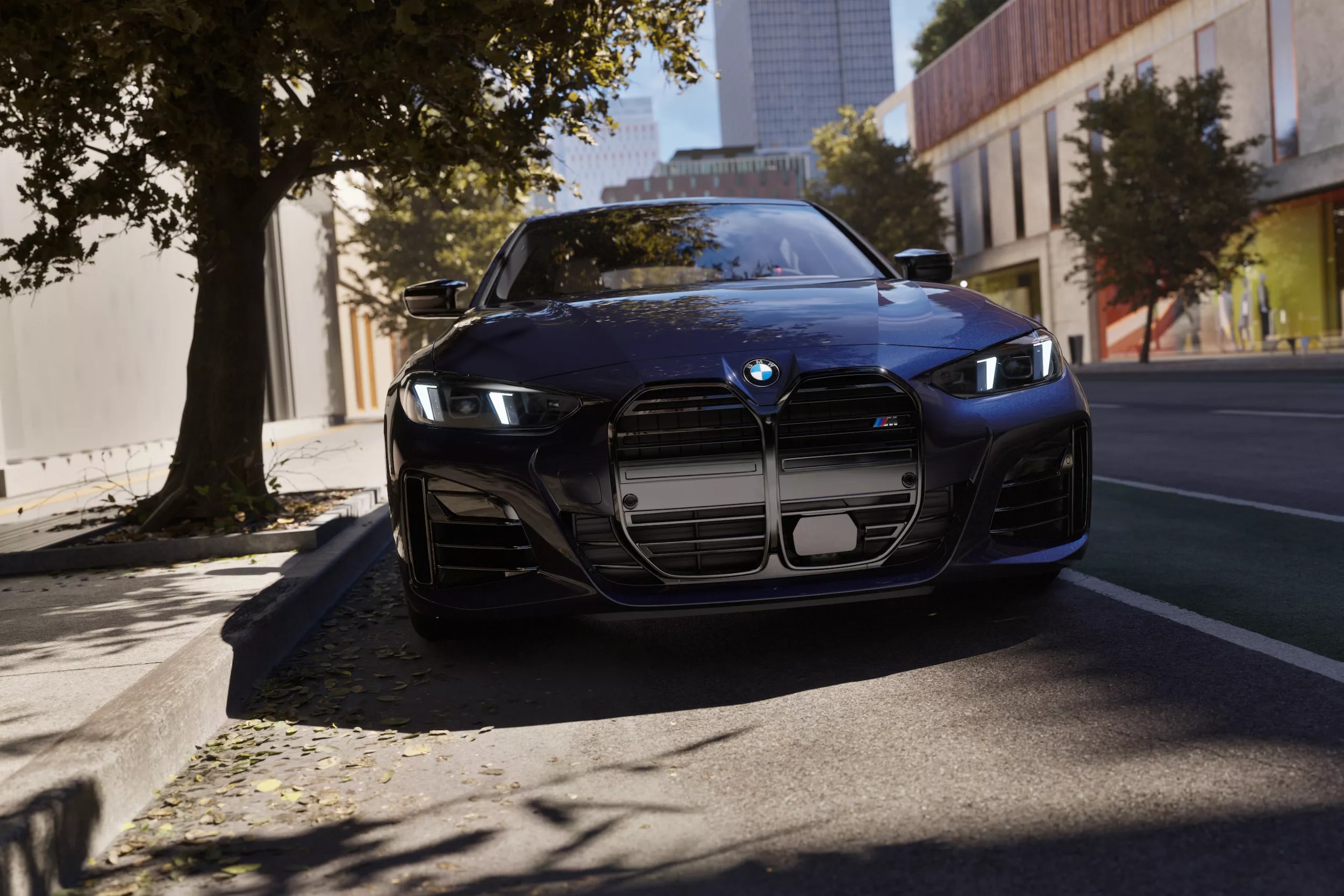 A black bmw m440i driving on a road in town.