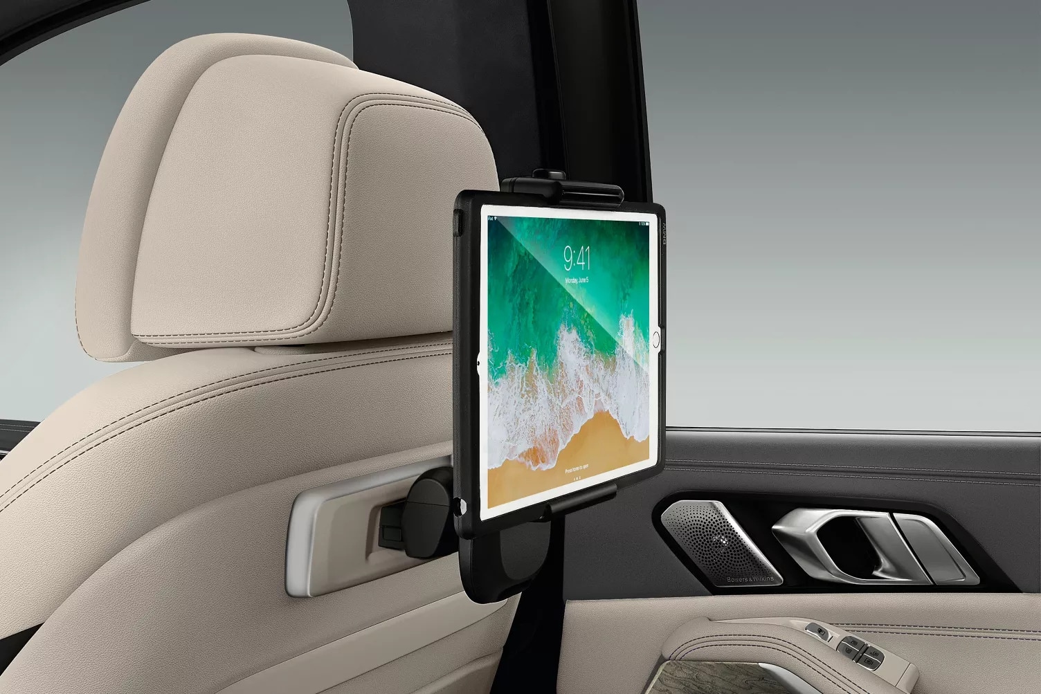 A tablet set up in the back of a bmw x7.