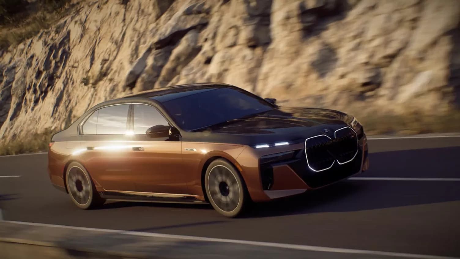 A brown bmw 7 series driving on the road.