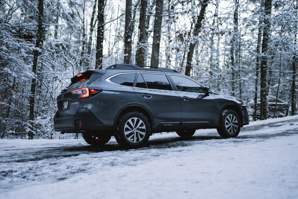 black%20suv%20on%20snow%20covered%20ground.png