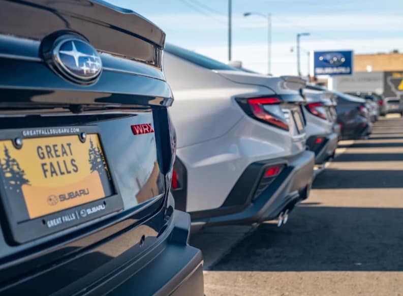 Subaru%20vehicles%20lined%20up%20at%20dealership%20lot.png