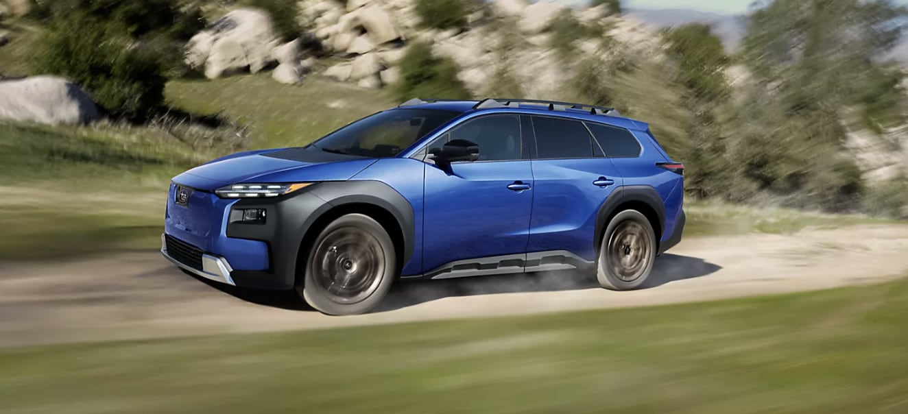 2026 Subaru Trailseeker in metal blue running on country road