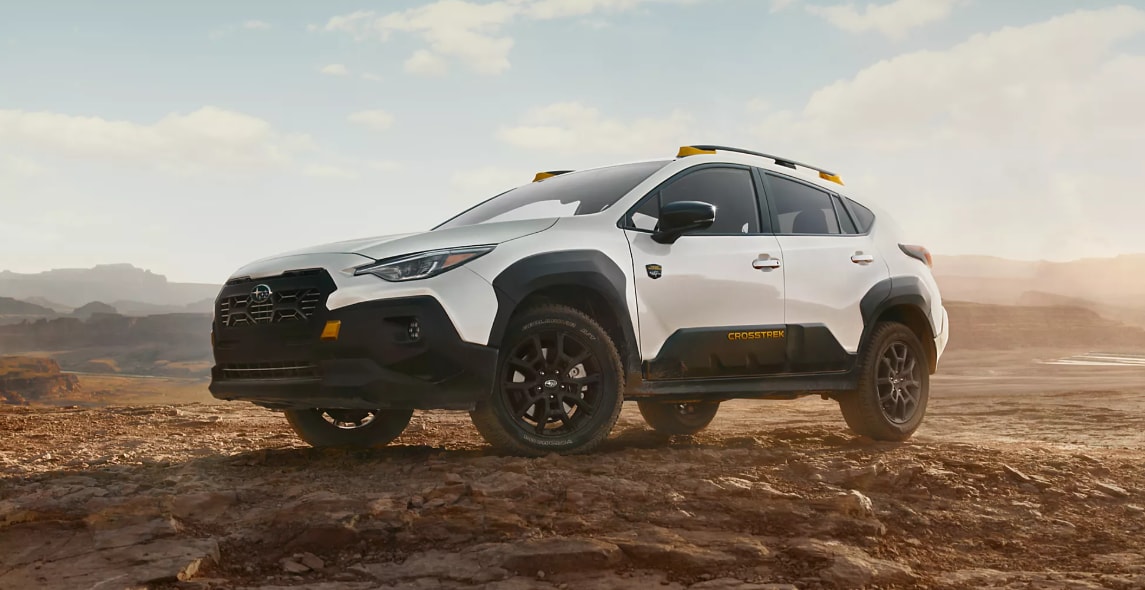 White Subaru Crosstrek Wilderness driving off-road.png