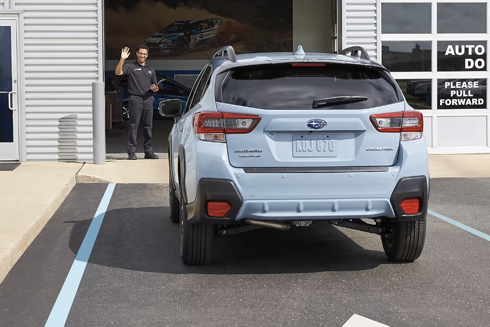 Subaru employee greeting customer