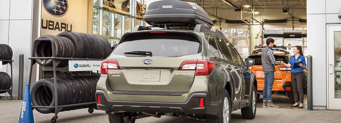 Rear%20view%20of%20a%20green%20Subaru%20Outback%20car.png