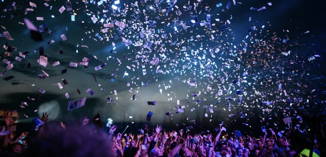 people%20celebrating%20with%20confetti%20flying.png