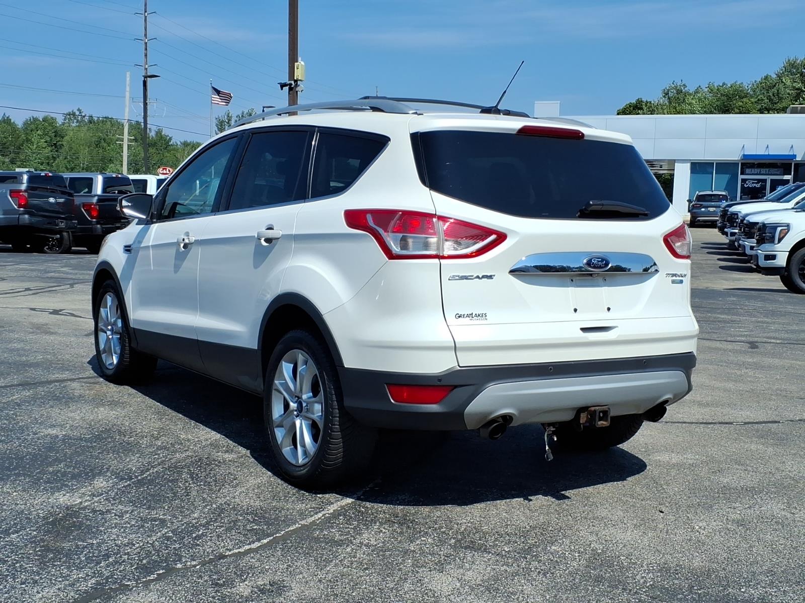Used 2014 Ford Escape Titanium with VIN 1FMCU9J94EUB87645 for sale in Muskegon, MI
