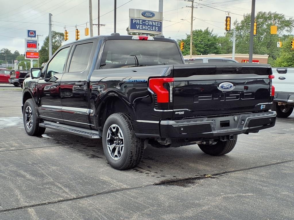 Used 2023 Ford F-150 Lightning XLT with VIN 1FTVW1EL3PWG61252 for sale in Muskegon, MI