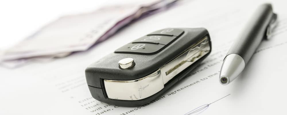 Car Key and Pen on Contract