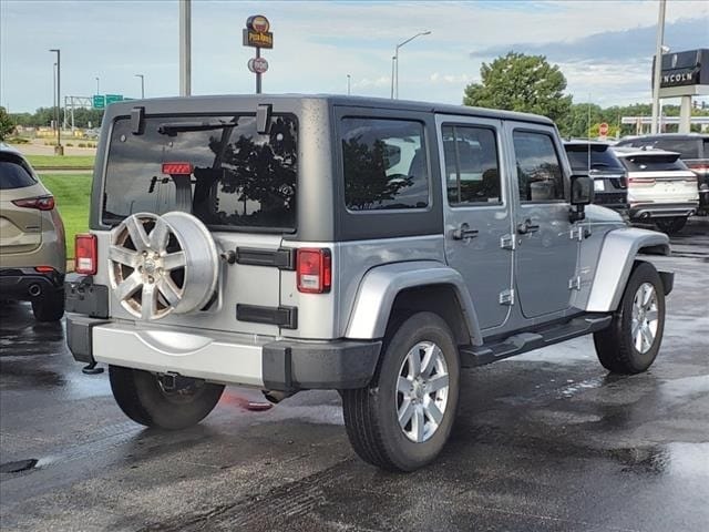 Used 2015 Jeep Wrangler Unlimited Sahara with VIN 1C4BJWEG1FL677760 for sale in Springfield, IL