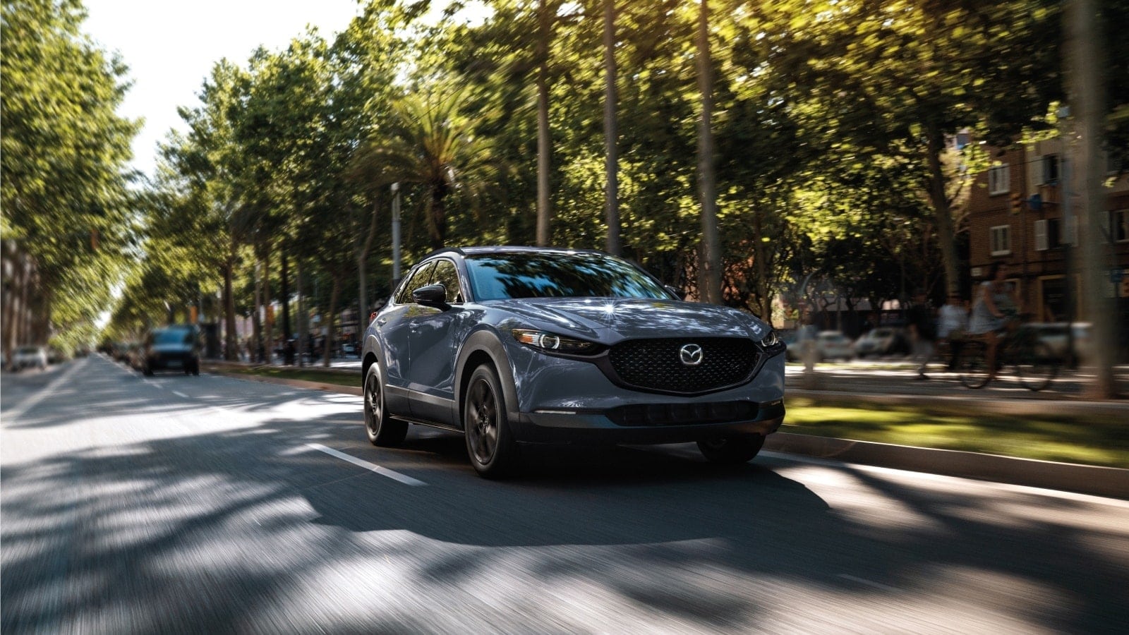 A pre-owned Mazda model on the road