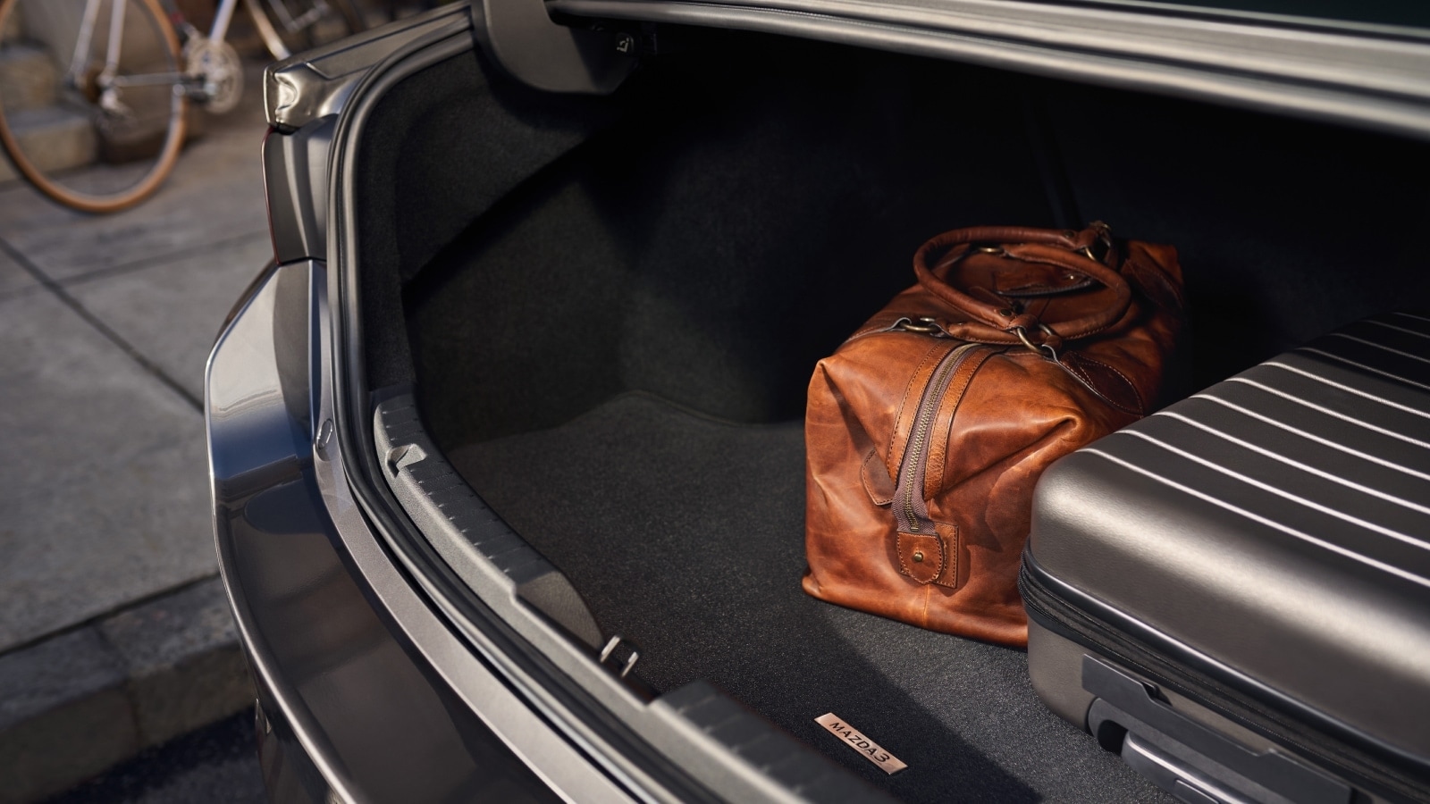 Loading cargo into the 2026 Mazda3 Sedan