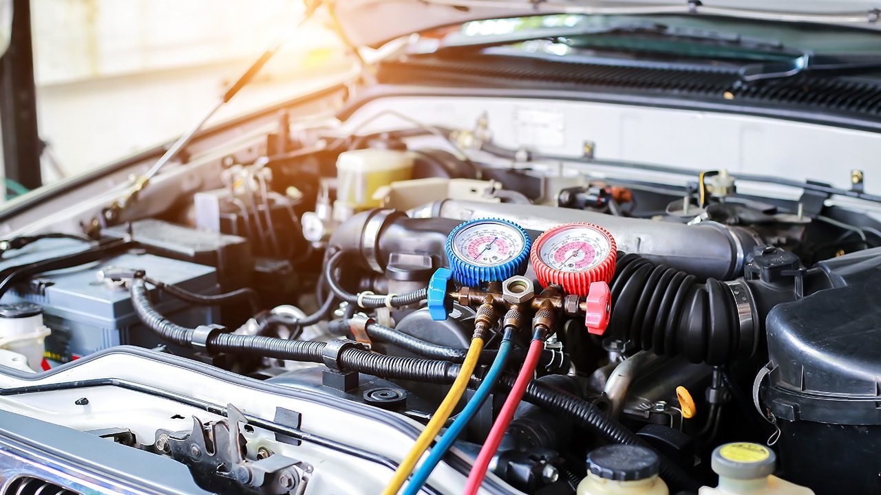 Technician working on AC during a Mazda service appointment