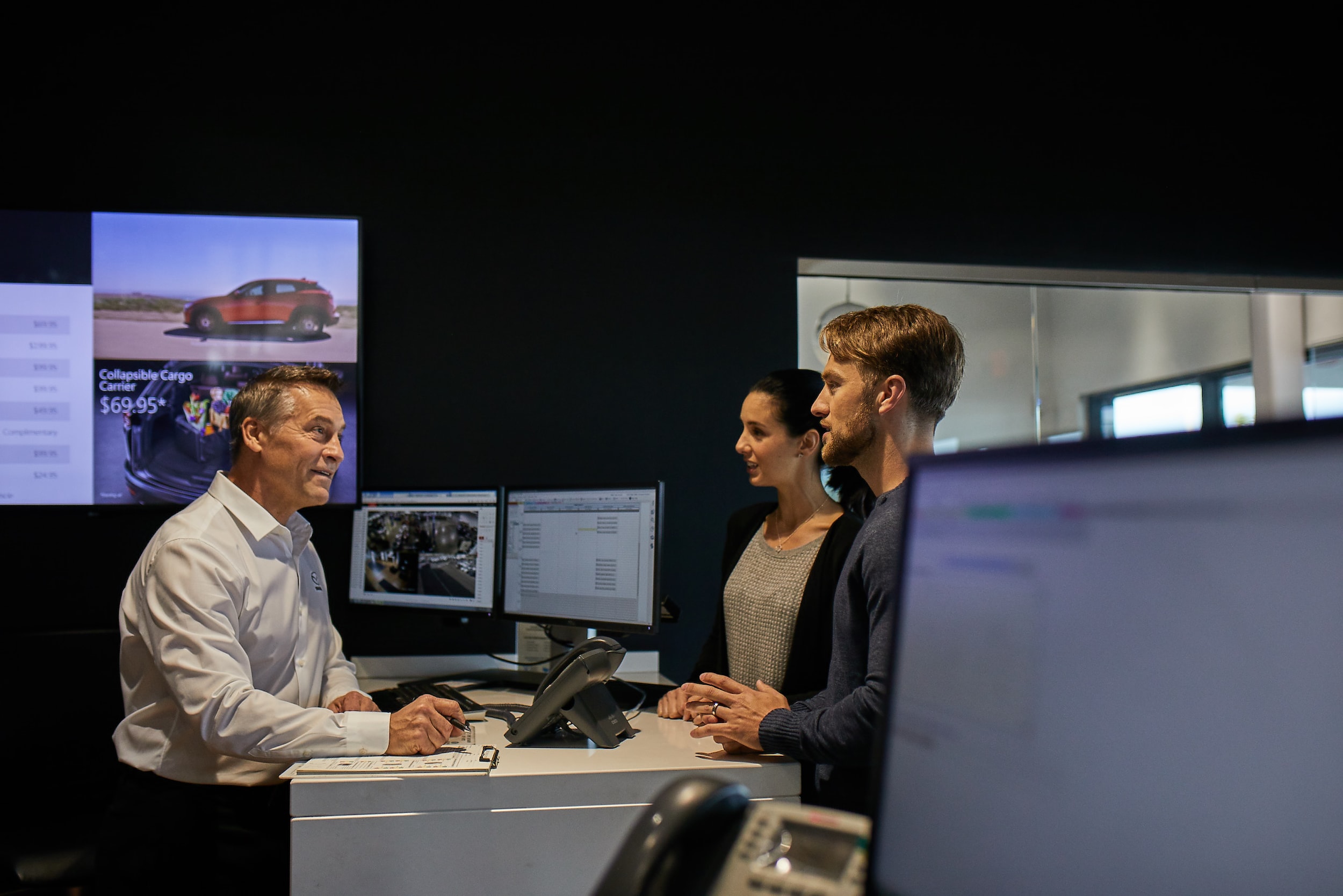 Couple visiting Mazda dealership.jpg