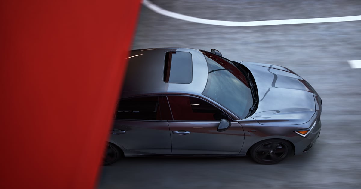 Top down view of a Acura Integra as it emerges from a tunnel