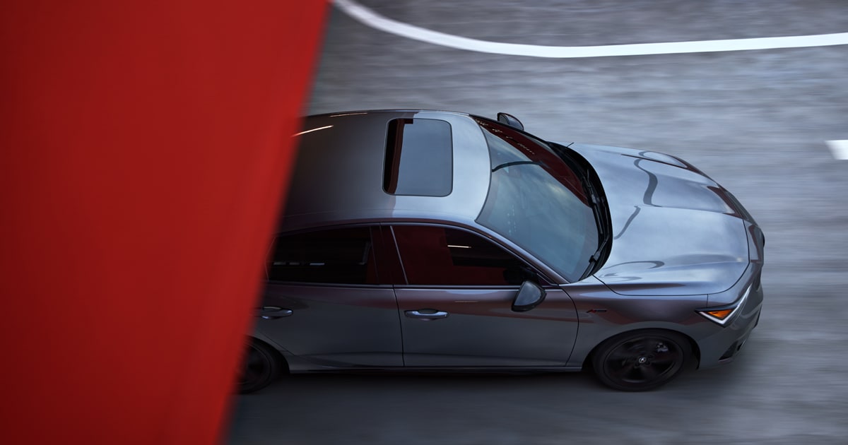 Overhead view of a Acura Integra driving out of a tunnel