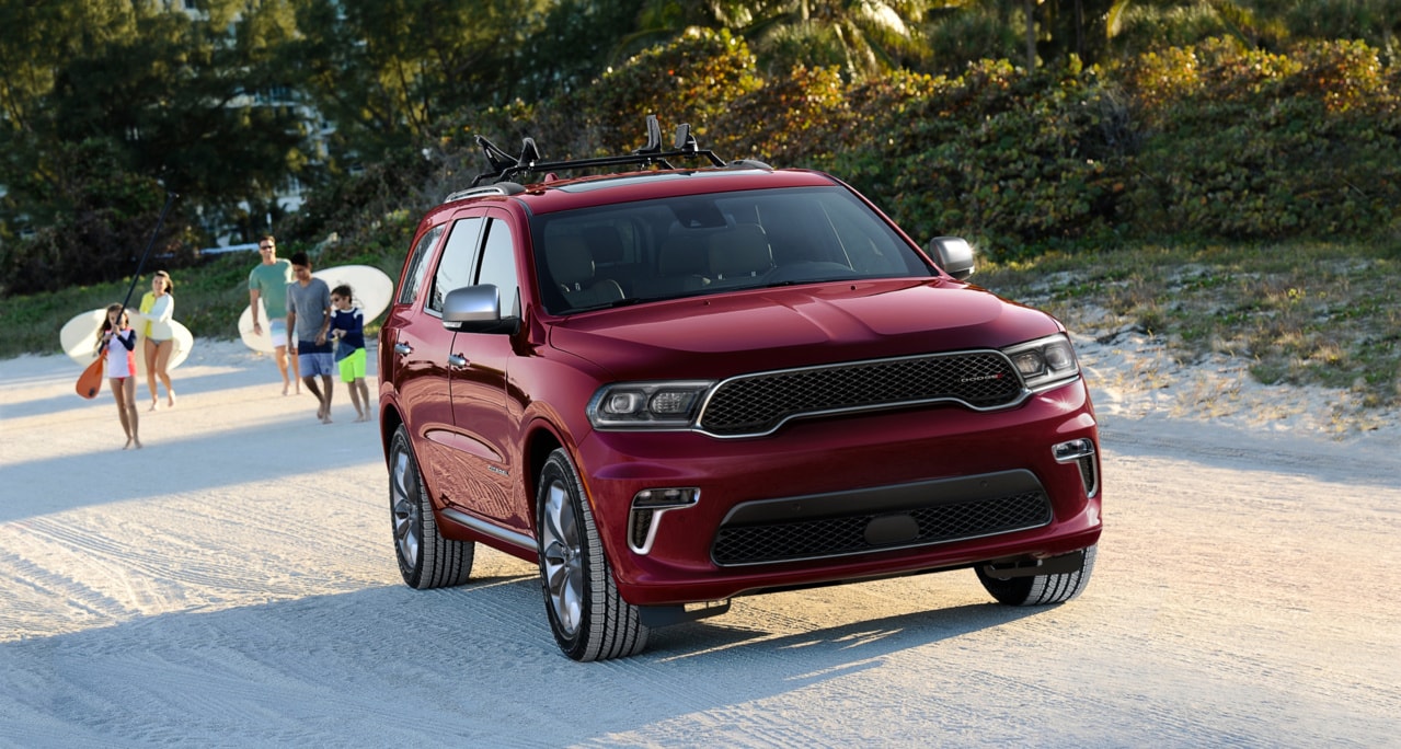 dodge durango parked next to a cement wall