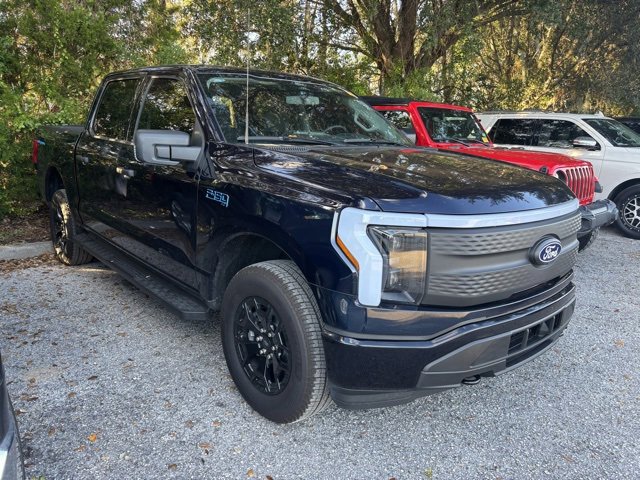 Used 2025 Ford F-150 Lightning XLT with VIN 1FTVW3LK6SWG10990 for sale in Orlando, FL