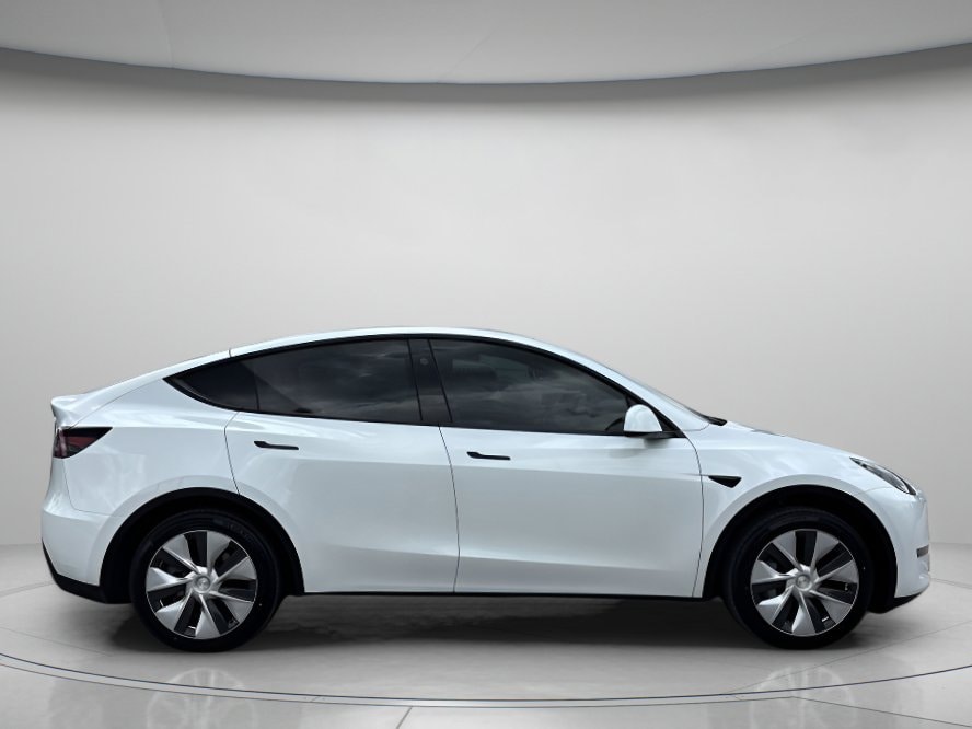 Used 2024 Tesla Model Y Long Range with VIN 7SAYGDED7RF018952 for sale in Orlando, FL