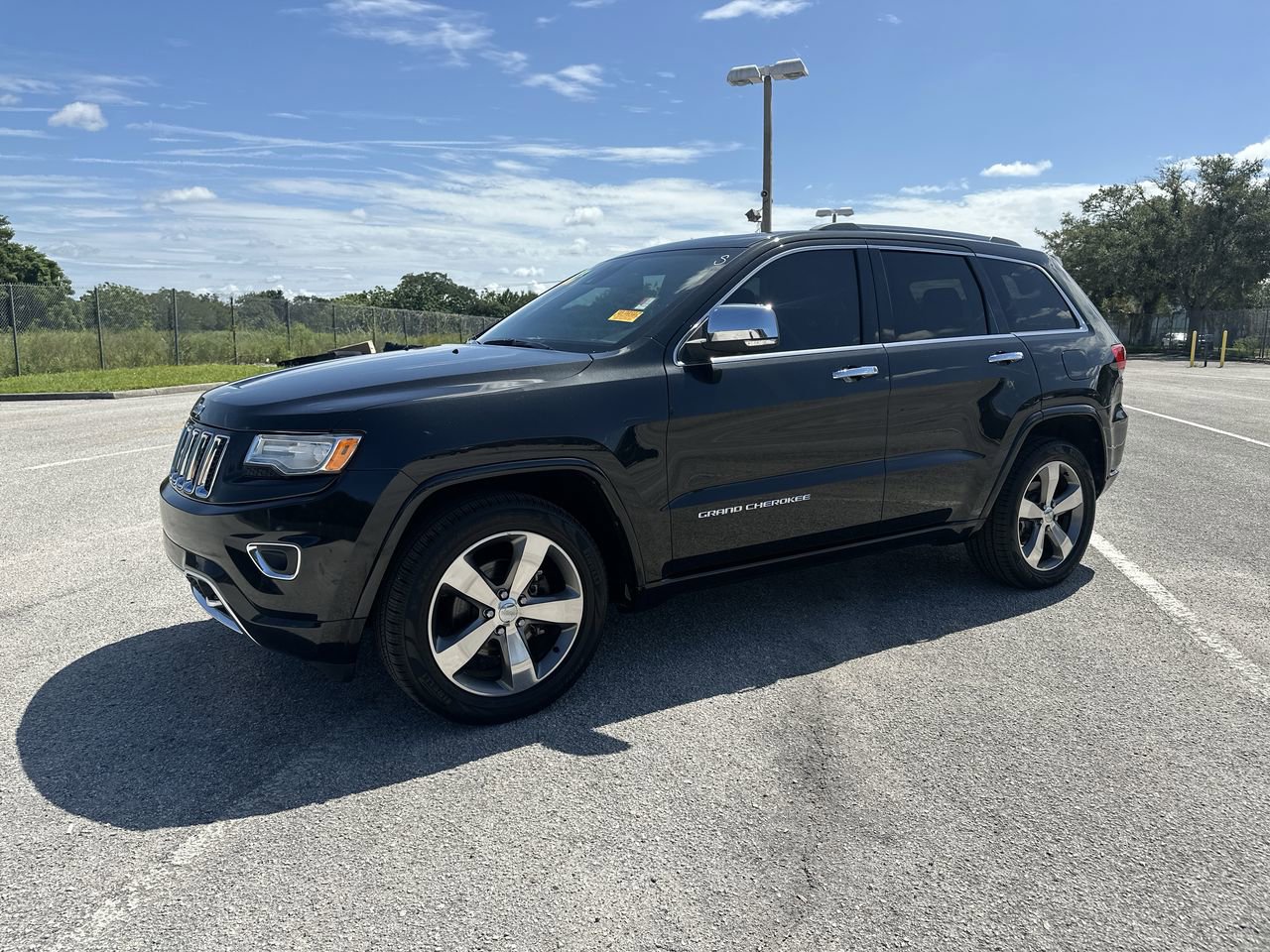 Used 2015 Jeep Grand Cherokee Overland with VIN 1C4RJECG5FC669608 for sale in Orlando, FL