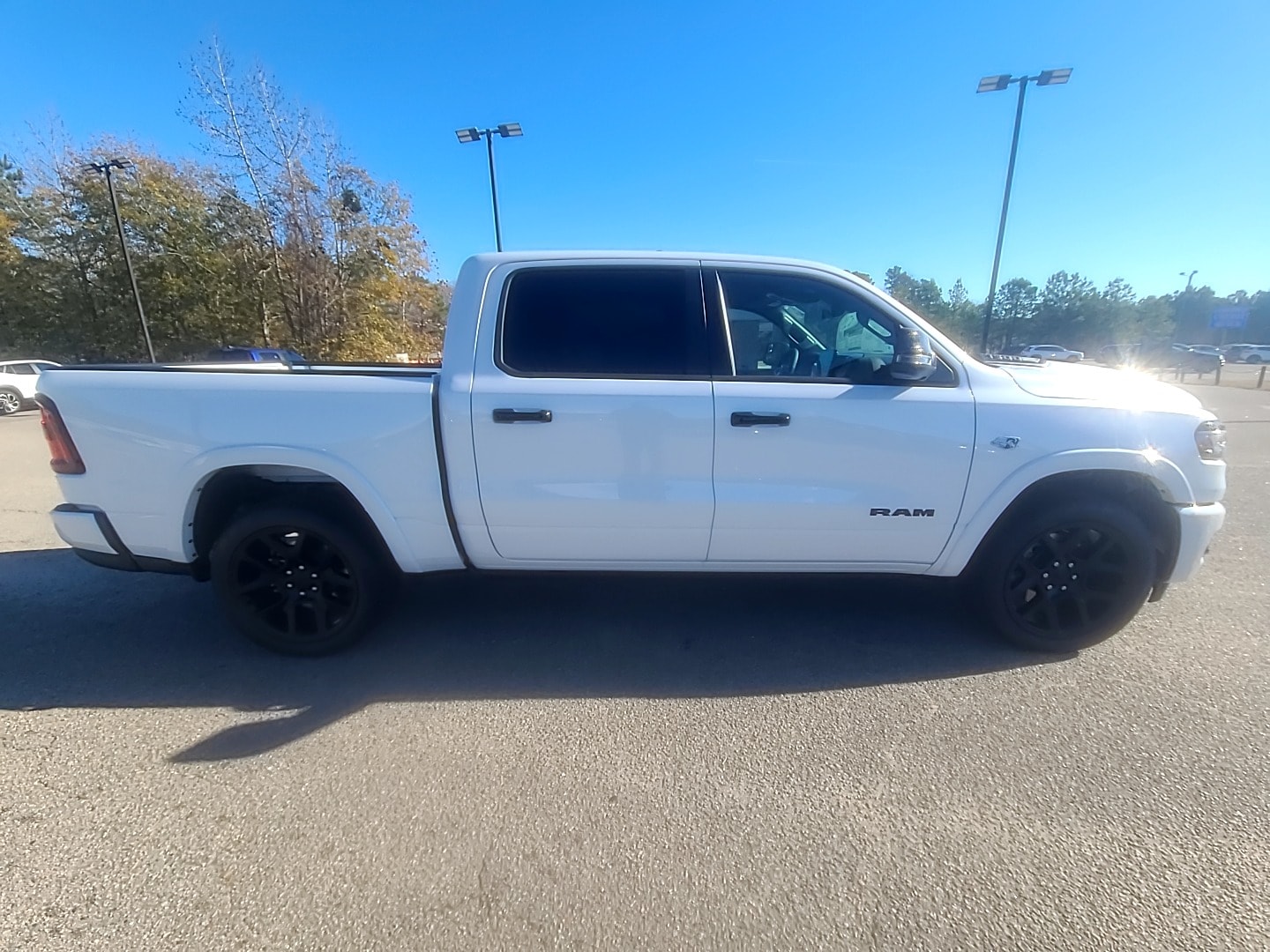 2026 Ram 1500 LARAMIE CREW CAB 4X4 5'7 BOX Ivory White Tri-Coat Pearlcoat at Griffin CDJR