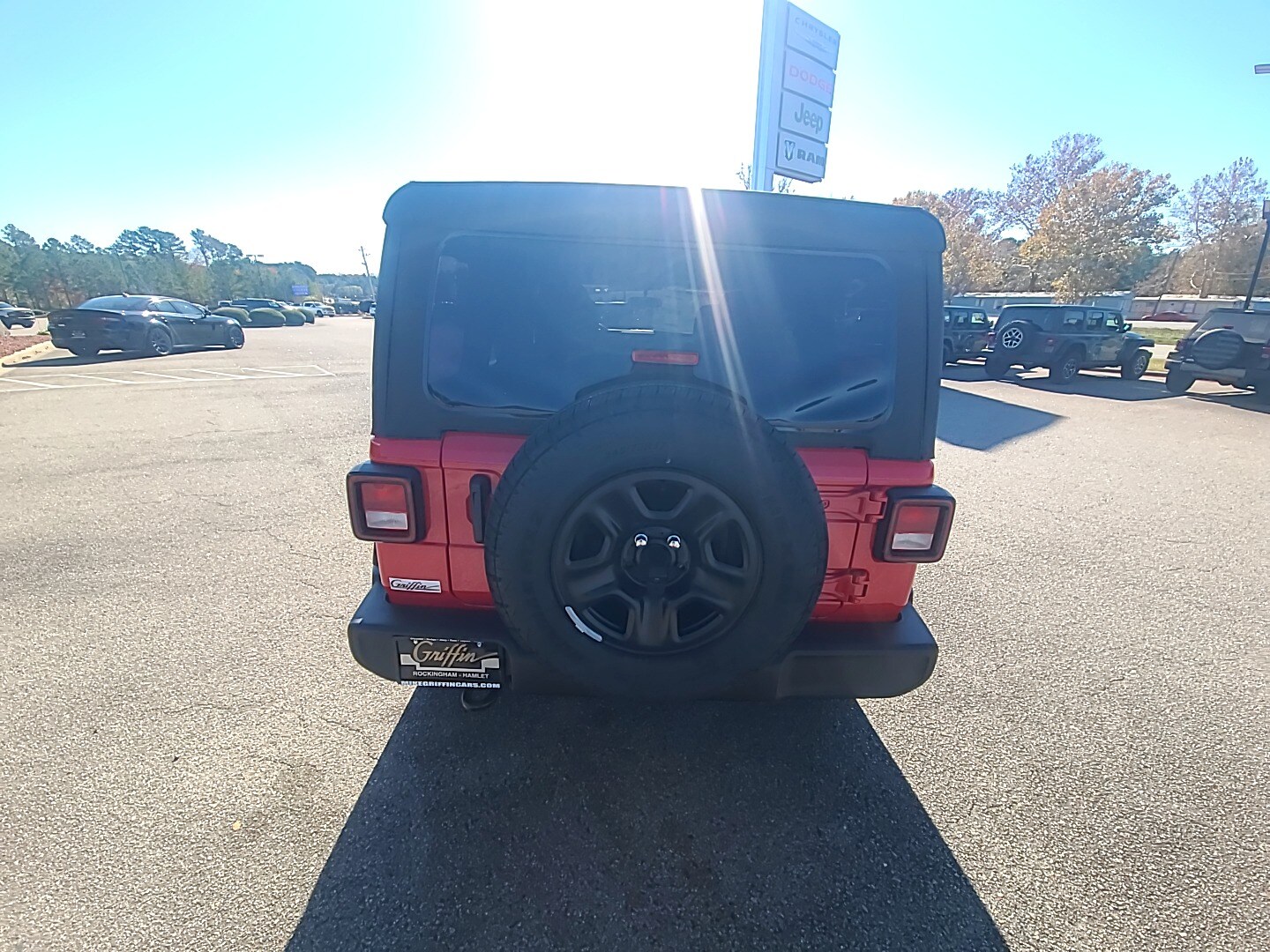 2026 Jeep Wrangler 4-DOOR SPORT firecracker red clearcoat at Griffin CDJR