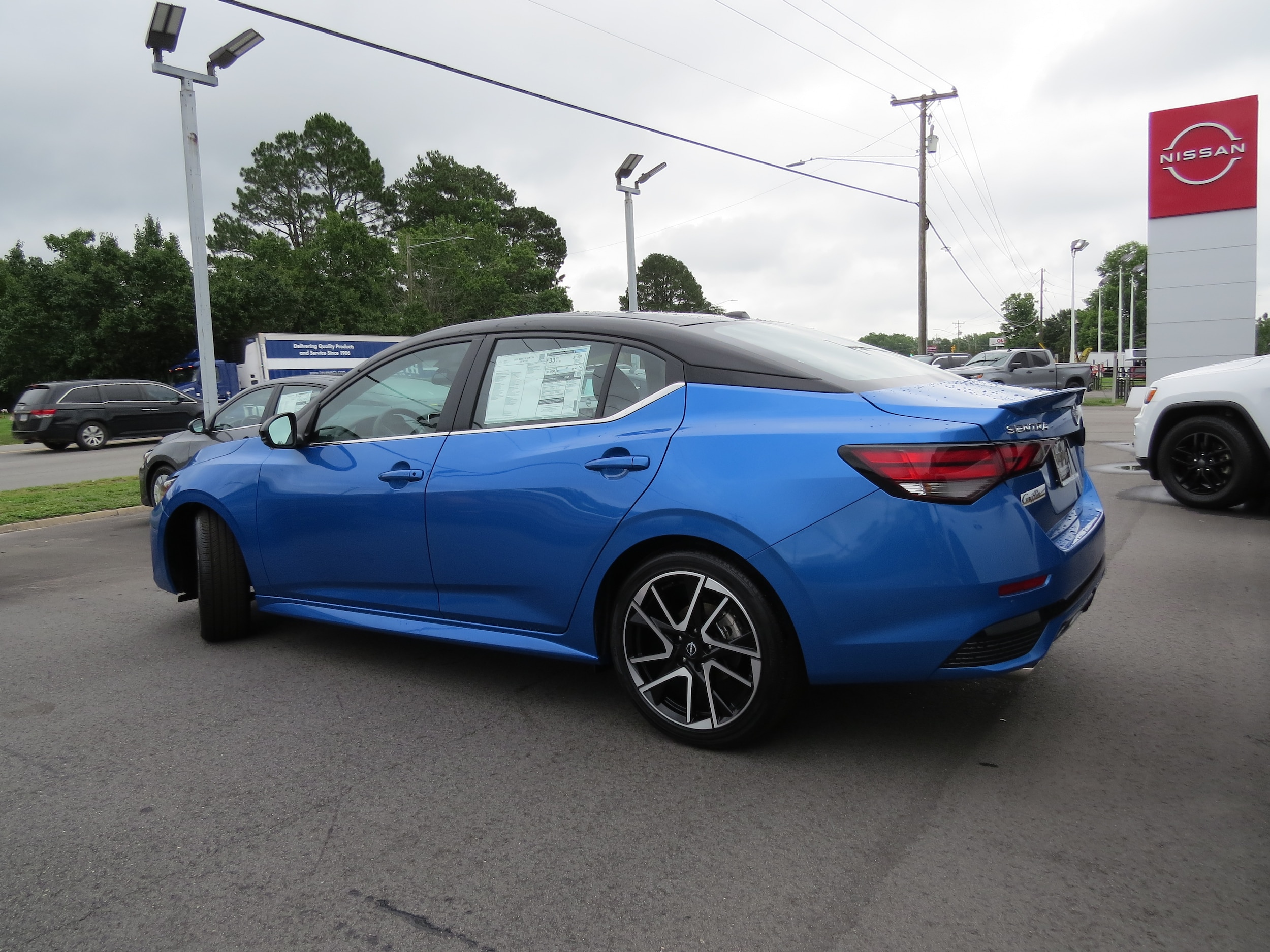 2025 Nissan Sentra SR Electric Blue/Super Black at Griffin Nissan