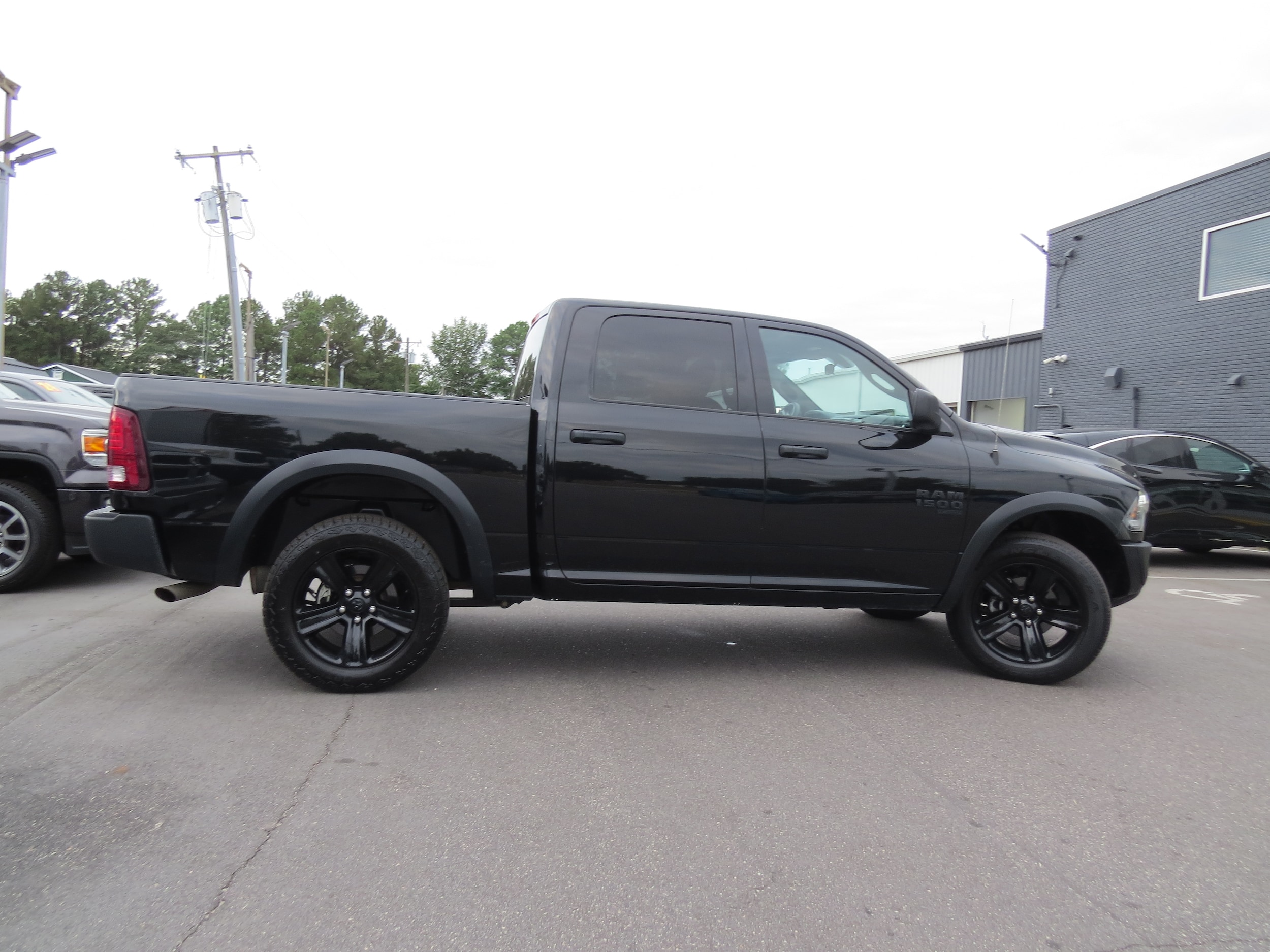 2024 Ram 1500 Classic Warlock Diamond Black Crystal Pearlcoat at Griffin Nissan