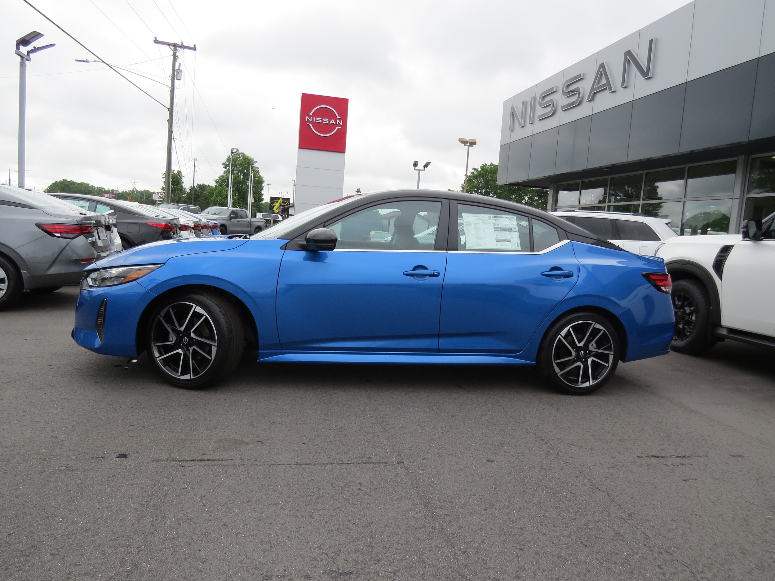 2025 Nissan Sentra SR Electric Blue/Super Black at Griffin Nissan