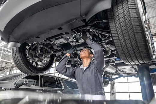 Technician performing multipoint inspection a Chevrolet vehicle