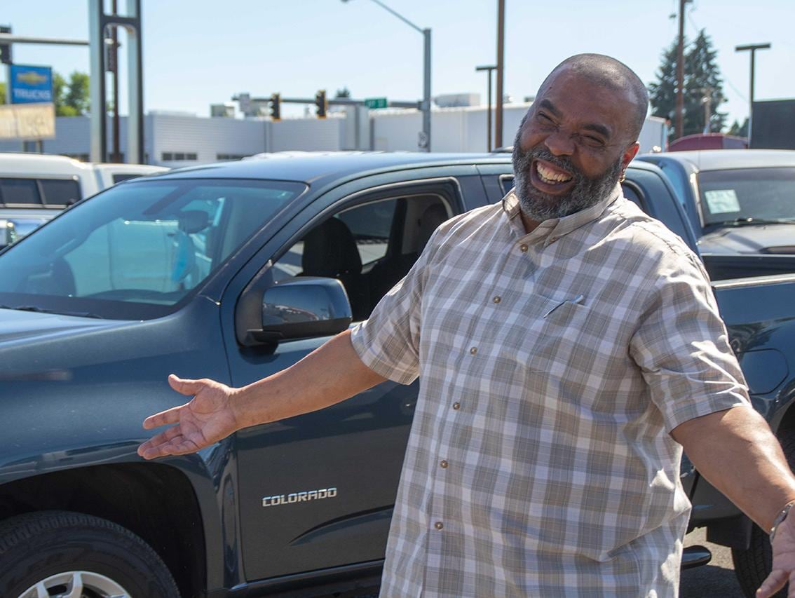 A smiling customer who has just located perfect Chevrolet Colorado Truck