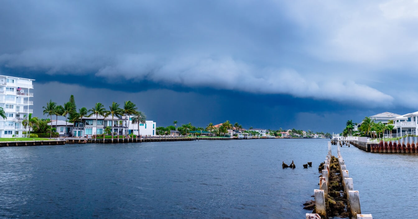 Panoramic shot of a Florida waterfront community as heavy clouds gather overhead.