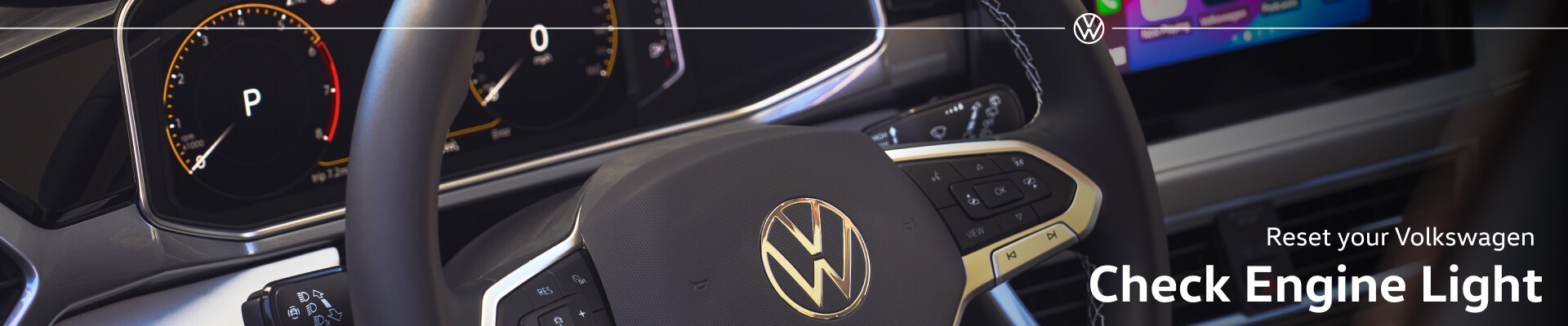 Volkswagen Taos SEL interior in Gray and Black Leather with leather-wrapped steering wheel displaying Apple CarPlay on center screen.