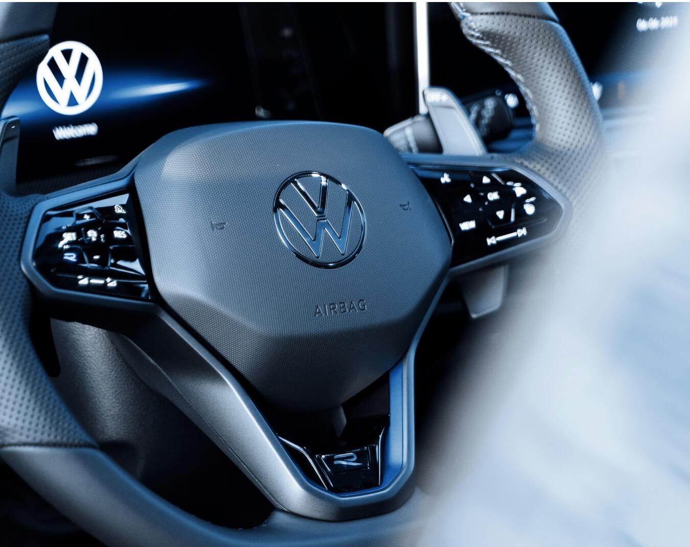 Volkswagen Golf R interior in Titan Black Nappa Leather with R-badged sport steering wheel displaying digital cockpit dashboard.