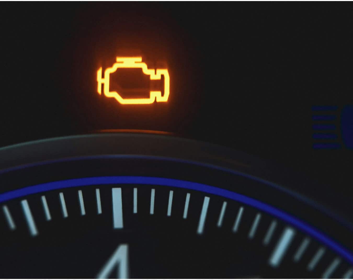 Volkswagen Golf GTI interior in Titan Black Cloth with illuminated instrument cluster showing check engine light.